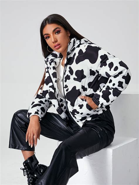 Get Moo-ving with our Stylish Cow Print Puffer Jacket